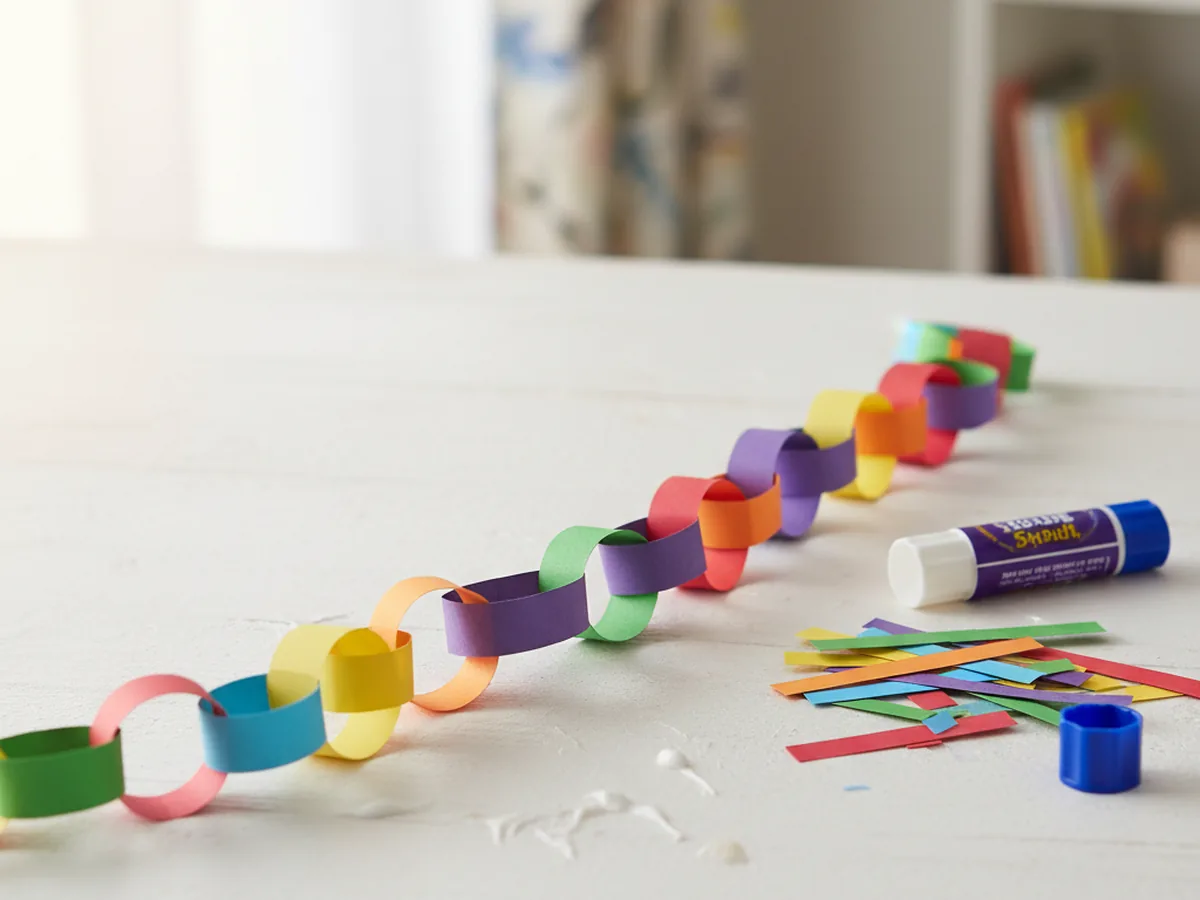 Colorful interlocking paper chain garland made from construction paper strips